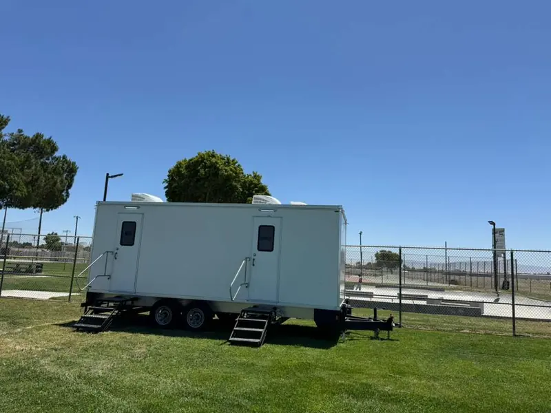 Restroom and shower combo trailer parked on a driveway