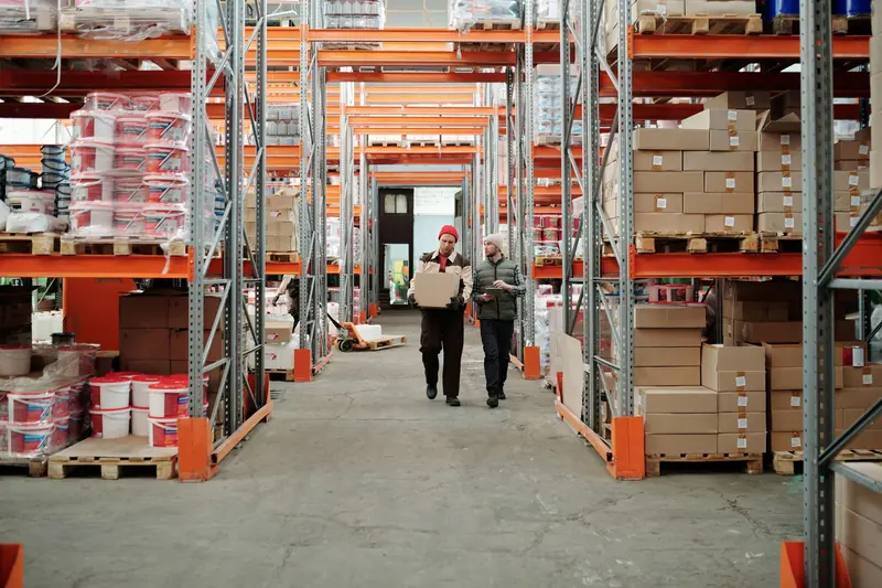 Warehouse workers talking on the distribution floor