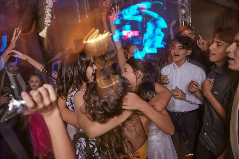 Family and friends celebrating at a quinceañera